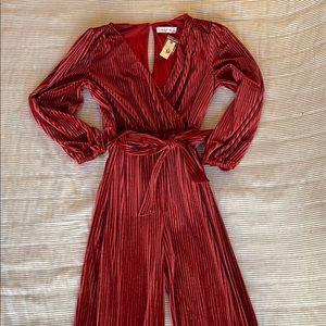 Red wide leg jumpsuit from Anthropologie